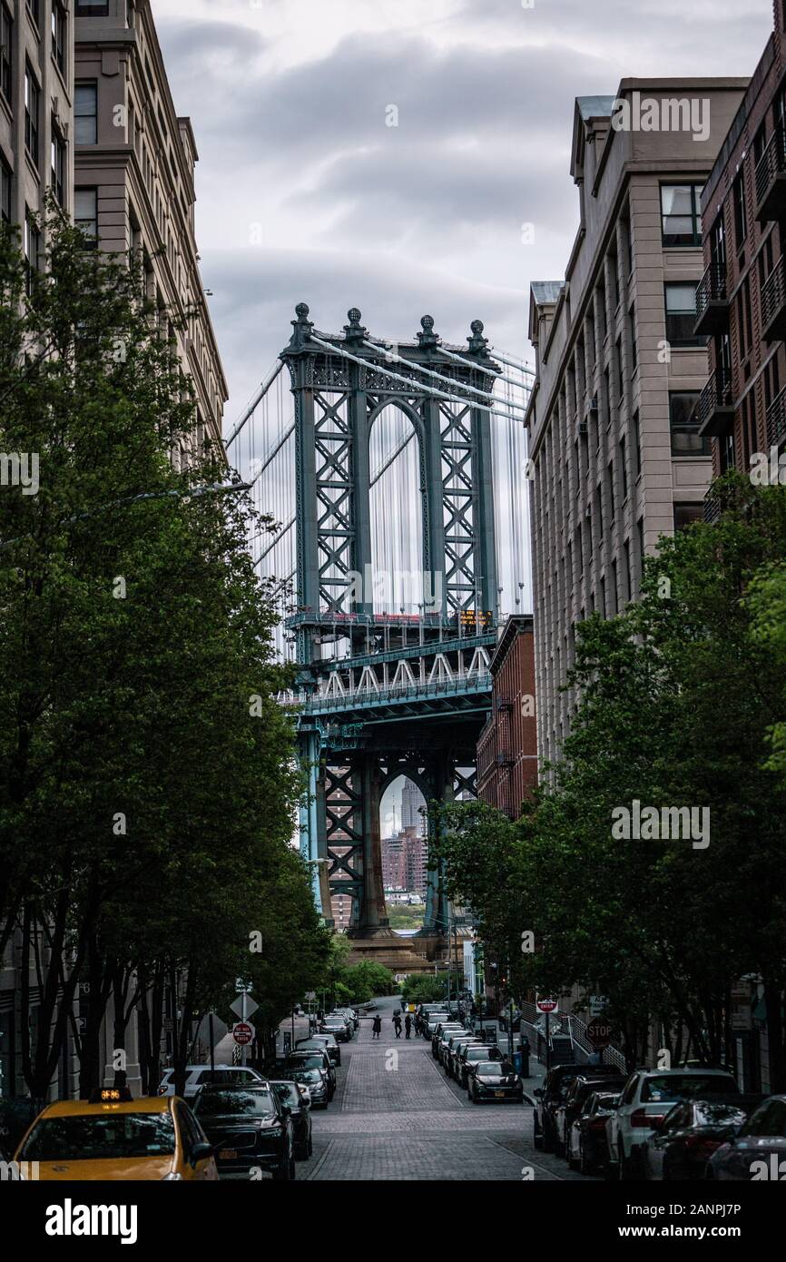 View of one of the towers of the Manhattan Bridge from the streets of the DUMBO district, Brooklyn, NYC Stock Photo