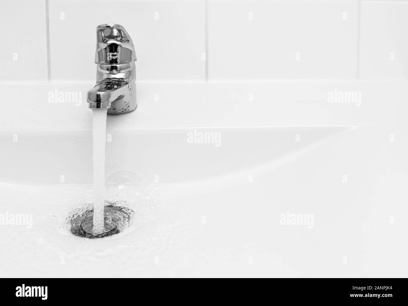 Water flow from chromed steel faucet Stock Photo Alamy