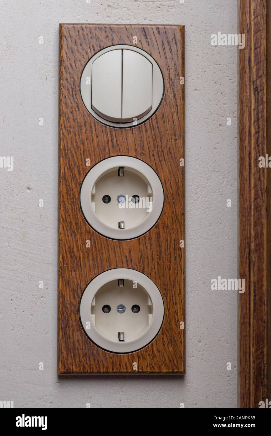 A Block Of Two Sockets And A Two Position Switch In Retro Style
