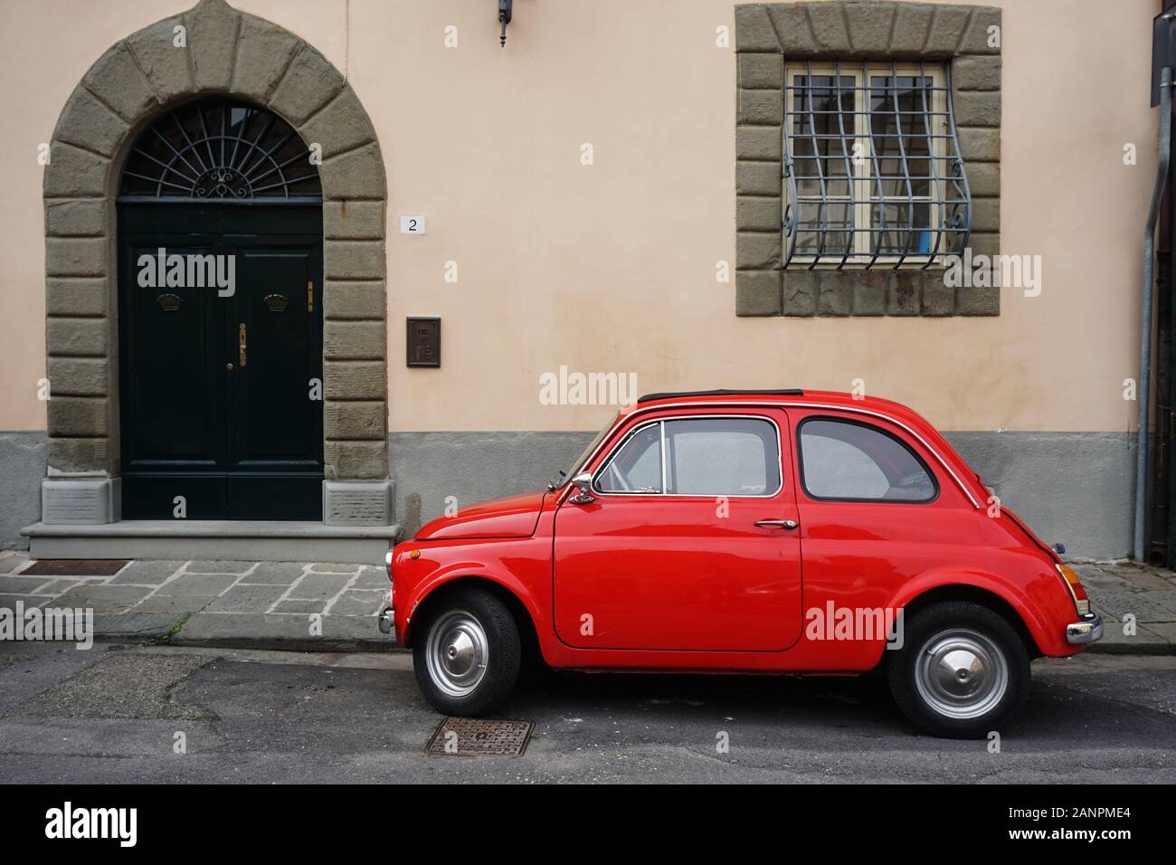 Red car parking in front of a house Stock Photo Alamy