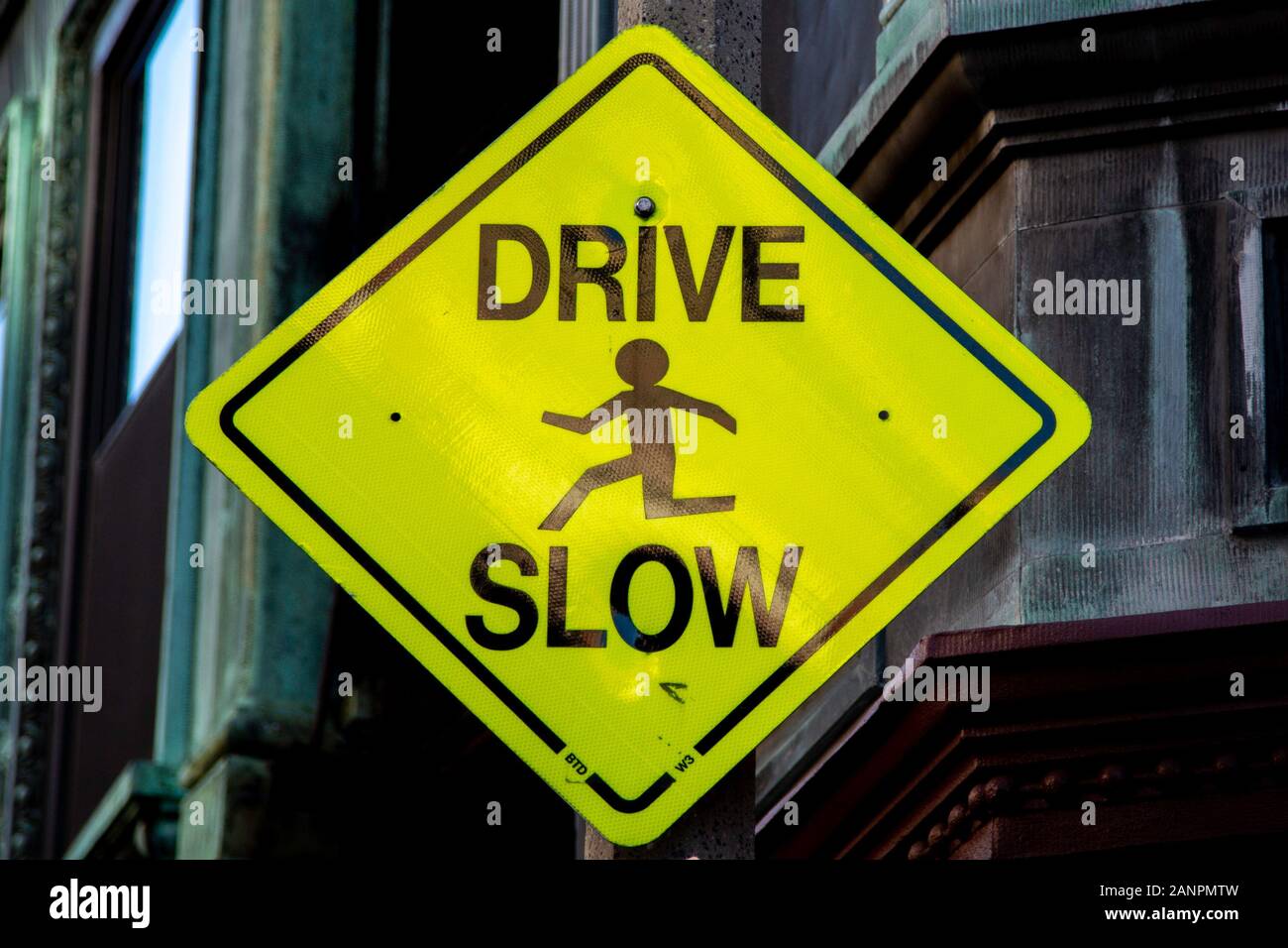 Drive slow sign in Boston Stock Photo