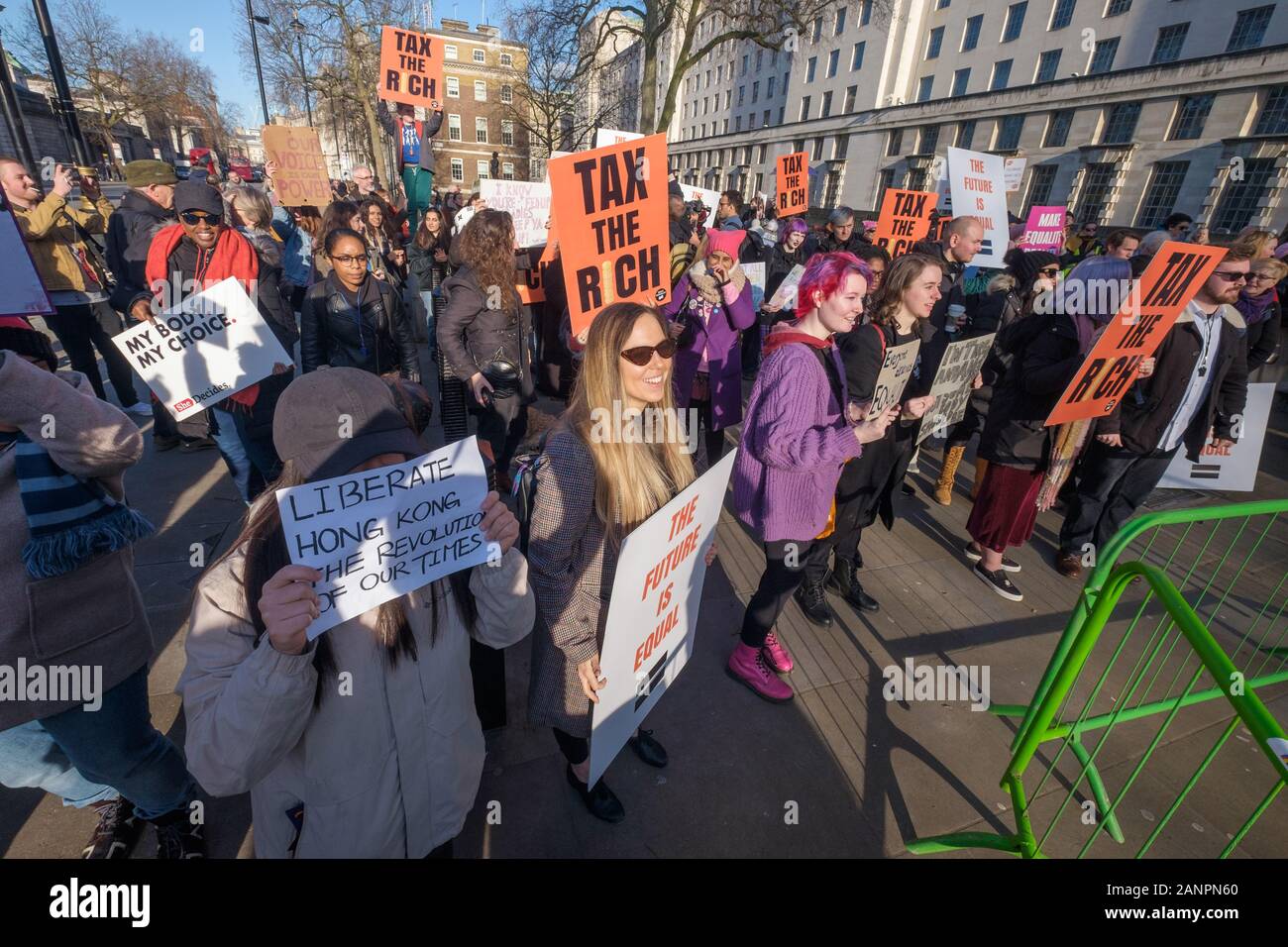 London, UK. 18th January 2019. A protest at Downing St was one of many in more than 30 countries before the exclusive World Economic Forum in Davos calling on the Government to listen to its citizens, not the wealthy elite and to demand a fairer, more equal and sustainable future. They want good education, decent jobs, healthcare for all,  an end to poverty wages, hunger and homelessness in the UK, fair taxation and an economy that serves people and planet rather than profiting from environmental destruction. Peter Marshall/Alamy Live News Stock Photo