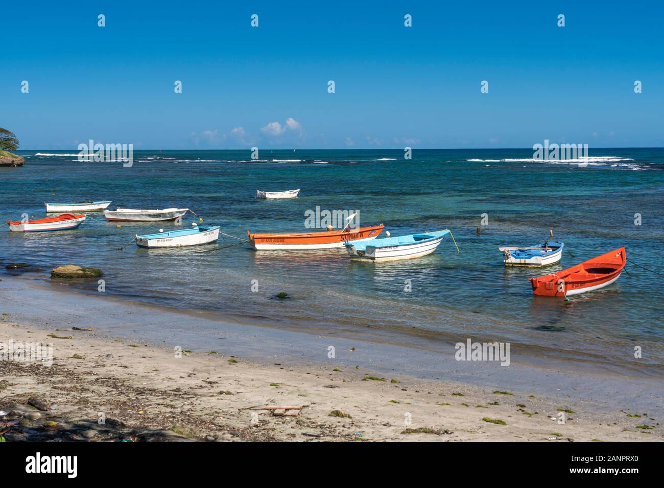 Colorful fishing boats in the water in Puerto Plata, Dominican Republic, Caribbean. Stock Photo