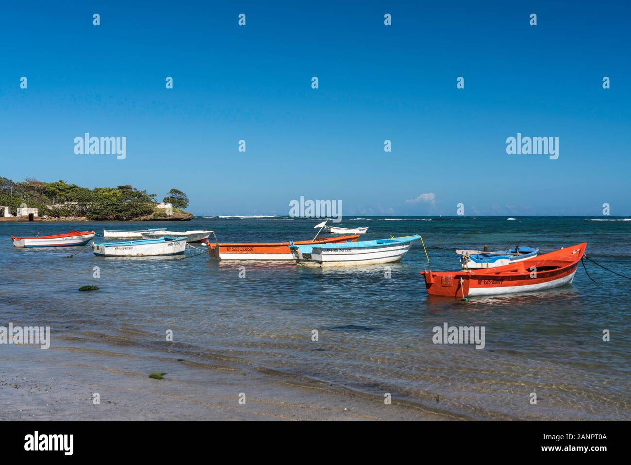 Colorful fishing boats in the water in Puerto Plata, Dominican Republic, Caribbean. Stock Photo