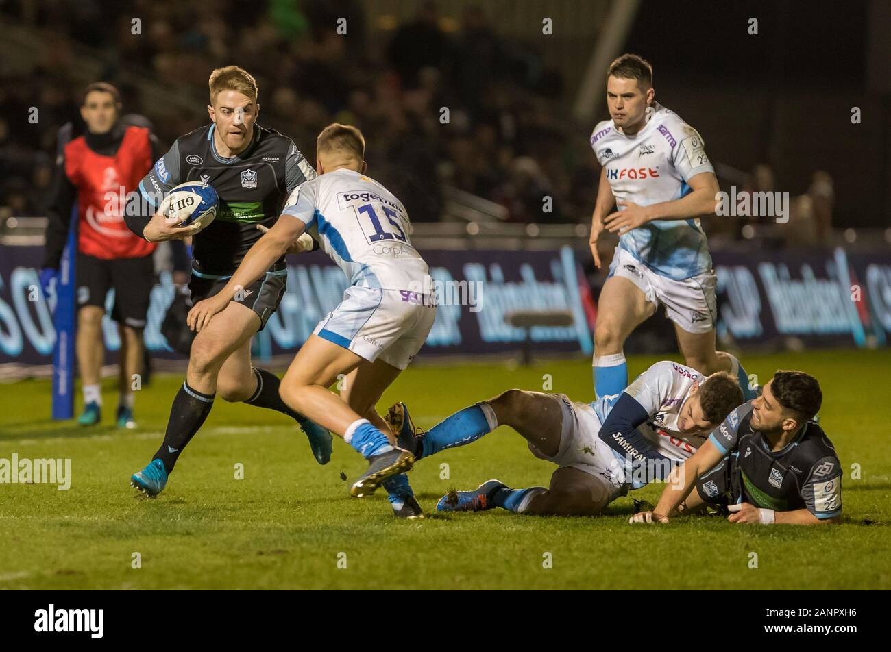 18th January 2020; AJ Bell Stadium, Salford, Lancashire, England; European Champions Cup Rugby, Sale Sharks versus Glasgow Warriors; Kyle Steyn of Glasgow Warriors takes on Joe Carpenter of Sale Sharks - Editorial Use Stock Photo