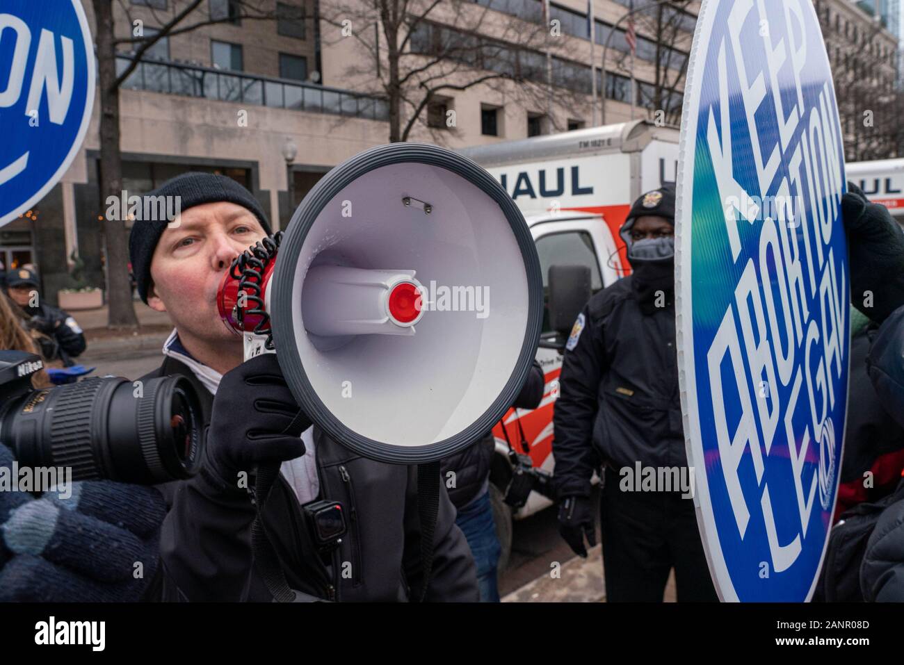 Washington DC, USA. 18th Jan, 2020. A pro-life protester shouts in a megaphone at pro-choice marchers as thousands turn out for the fourth annual Women's March rebuking President Donald Trump and his administration in Washington, DC on Saturday, January 18, 2020. Photo by Ken Cedeno/UPI. Credit: UPI/Alamy Live News Stock Photo