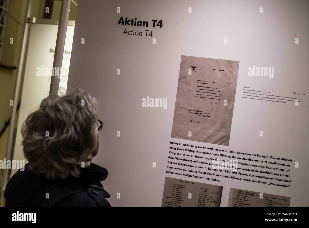 Munich, Bavaria, Germany. 18th Jan, 2020. Guests at an exhibition honoring the victims of the Nazi T4 Euthanasia program read the reconstructions of the lives of victims. Honoring the victims on the 80th anniversary of their categorization as "unfit to live"" by the Nazi terror regime, the Bavarian Interior Ministry held a memorial program in connection with an exhibition at the Ministry. The National Socialist terror regime began the program near Munich and through it rounded up disabled and chronically ill people, declared them "unfit to live"" then deported them to face execution. Stock Photo