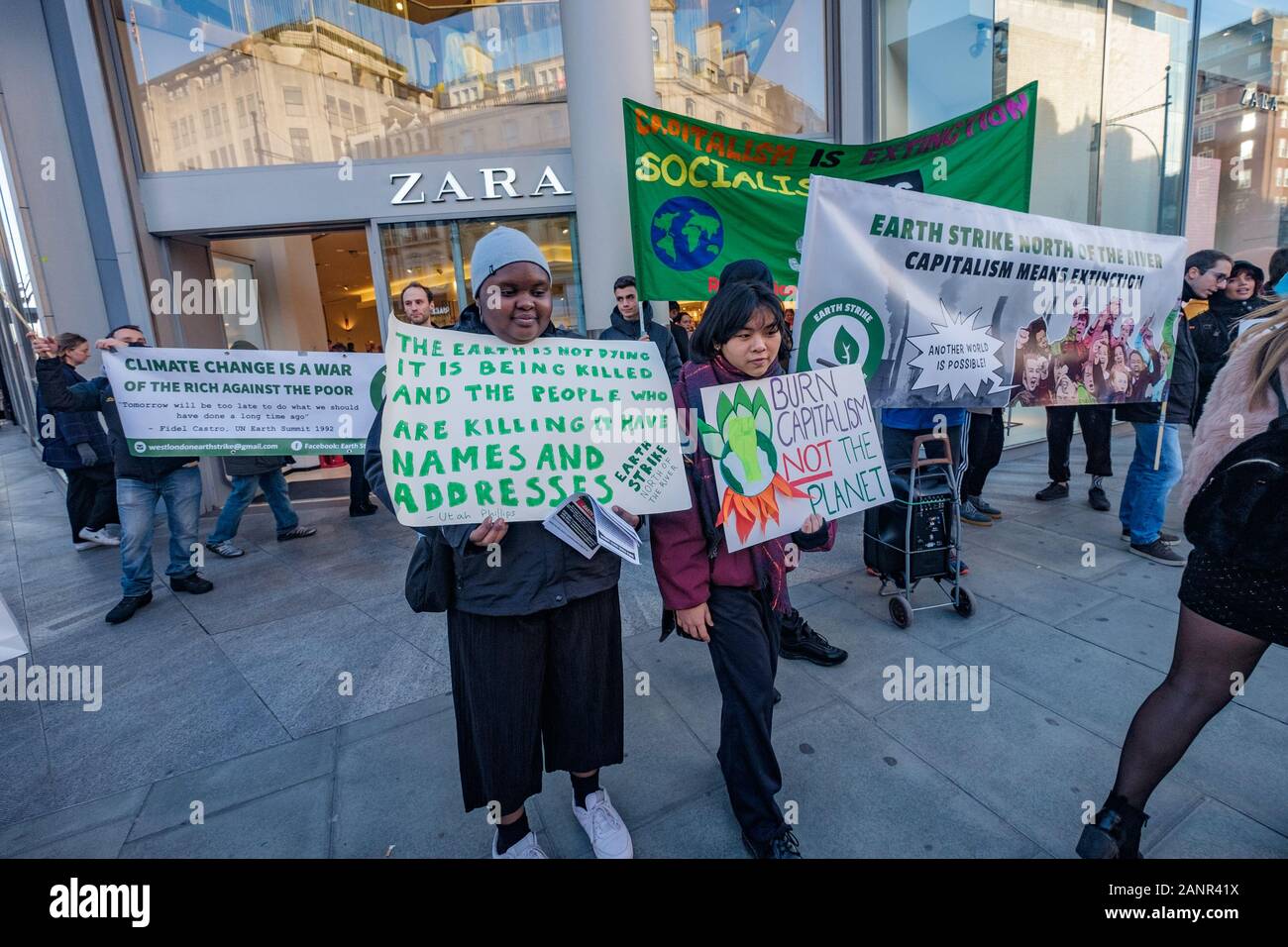 London, UK. 18th January 2019. Earth Strike protest outside fashion store Zara on Oxford Street because of its involvement in the plunder of the planet, people and resources. The fashion industry is the second largest contributor to global pollution. Earth Strike say no to the exploitation of the Global South, to imperialism and the destruction of the environment. Peter Marshall/Alamy Live News Stock Photo
