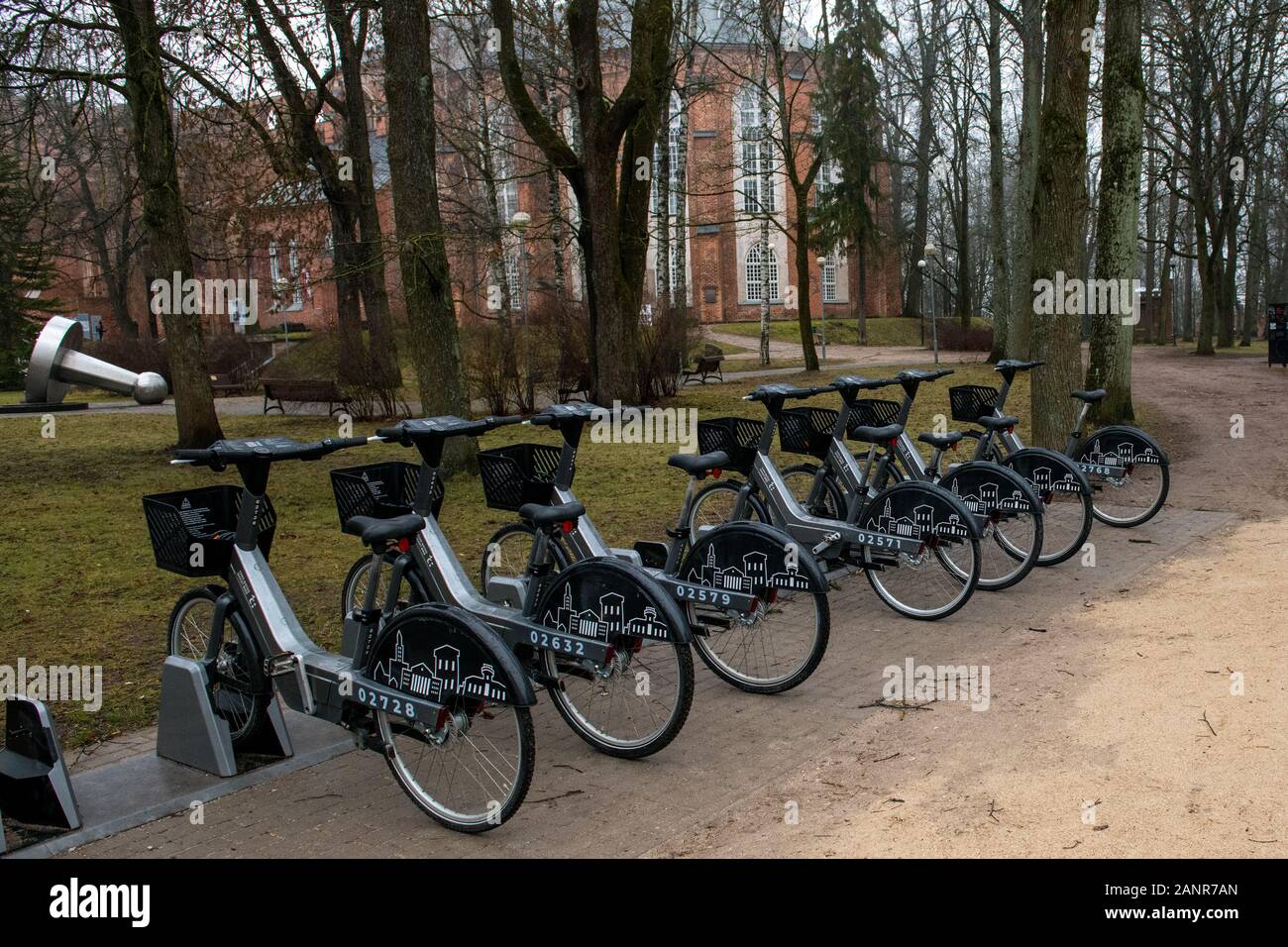 Smart bikes for rent in Toome Park, Estonia, with University of Tartu  Museum and Tartu Cathedral in background Stock Photo - Alamy