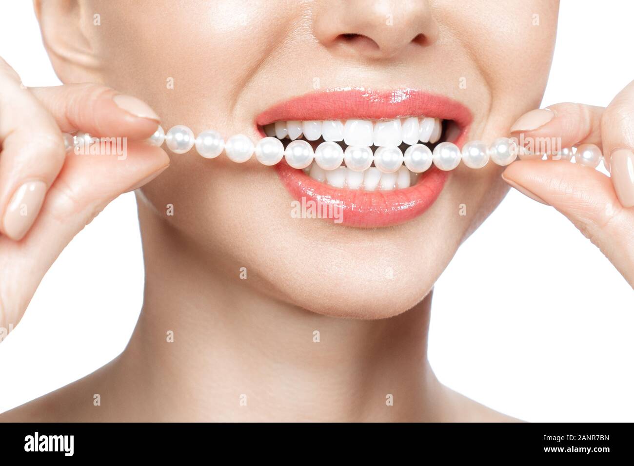 Beautiful female teeth smile and pearl necklace, Dental Health Concept Teeth whitening. Dental clinic patient. Image symbolizes oral care dentistry Stock Photo