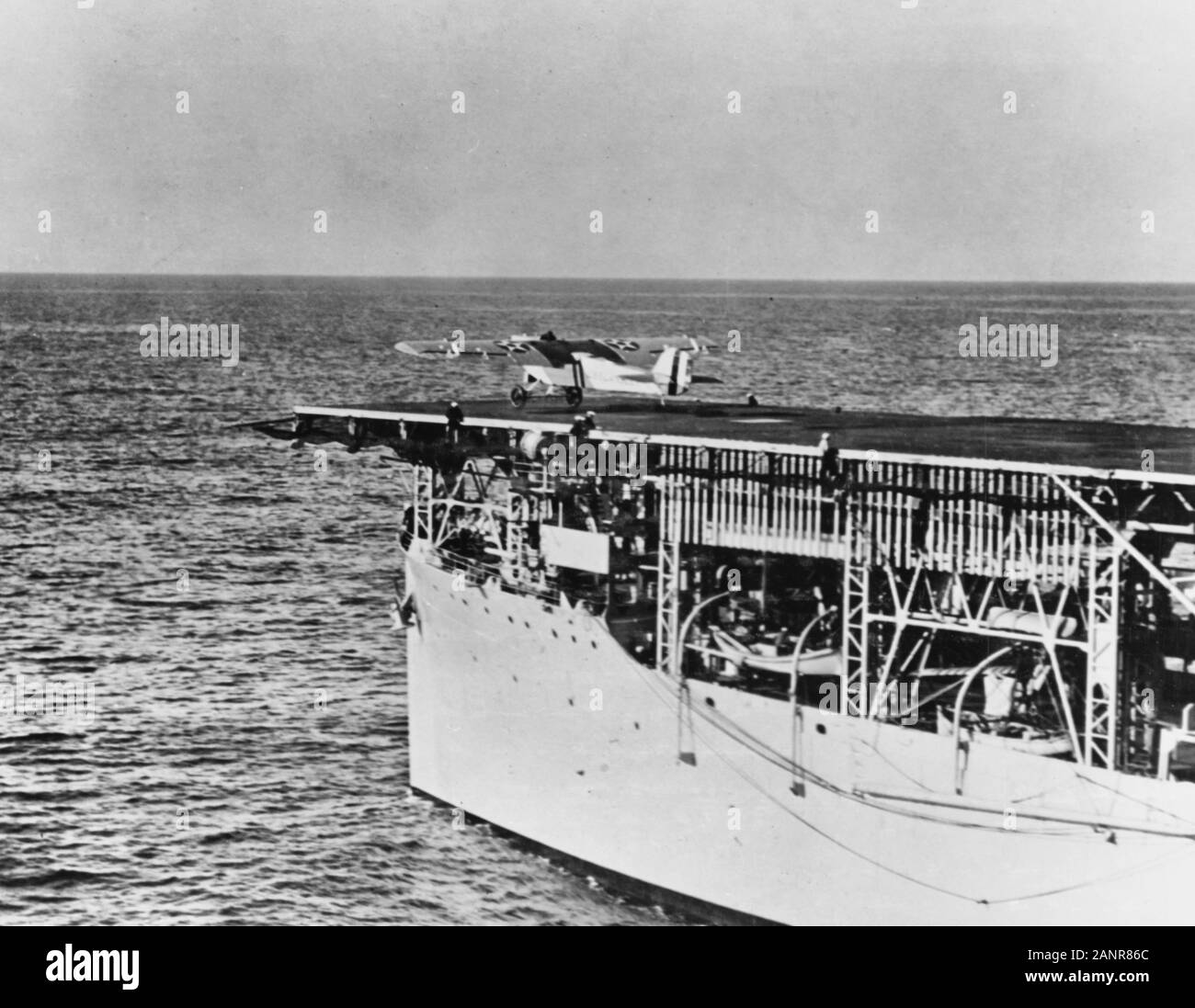 USS Langley (CV-1) Launching a Martin MO-1 observation plane, during the 1920s. Stock Photo