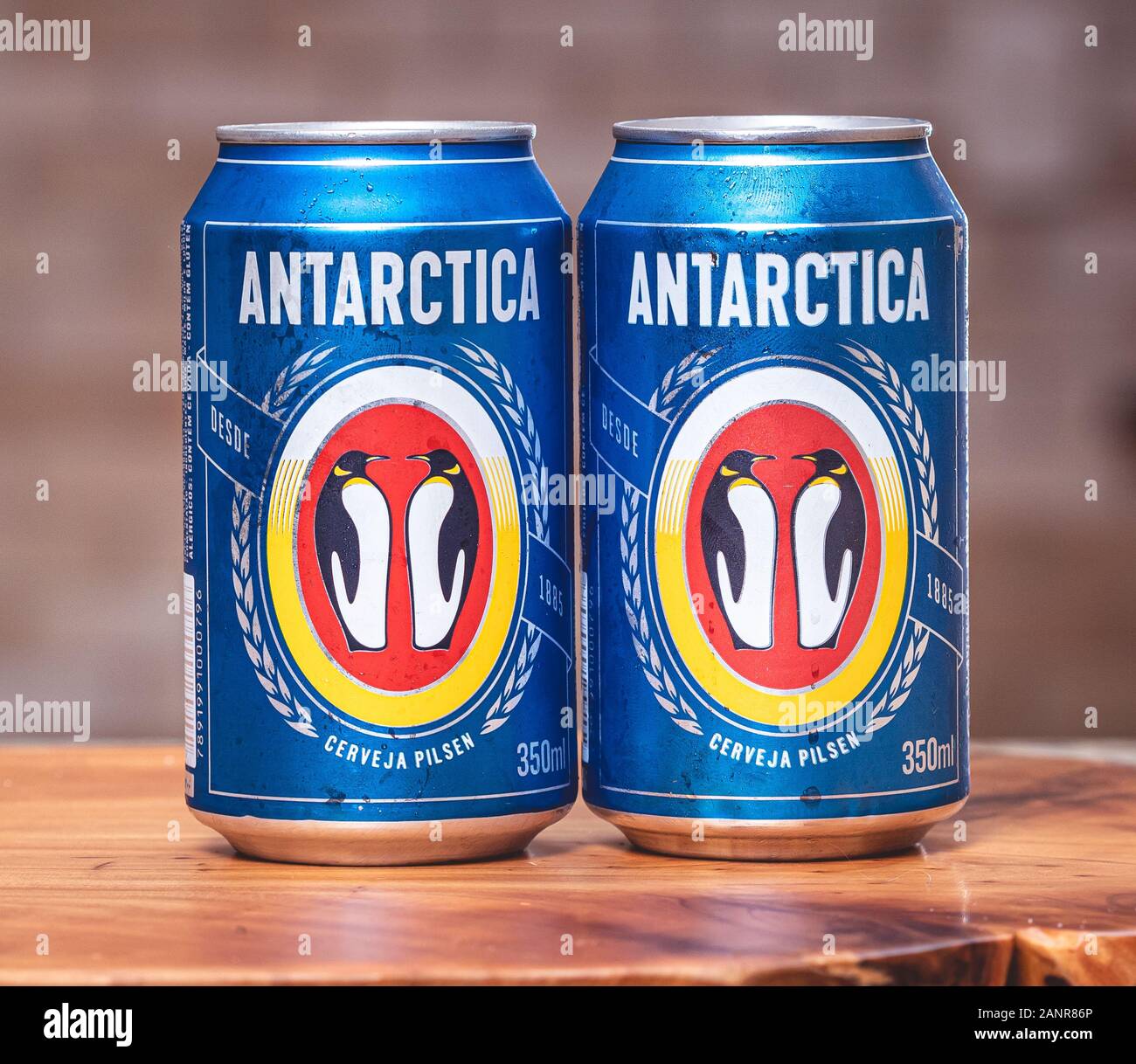 Two cans of beer from the Antarctica brand. Cerveja Antarctica Pilsen is part of the AMBEV group. Stock Photo