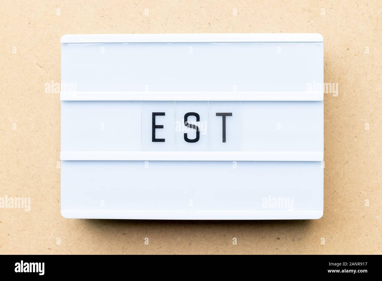 White Lightbox With Word Est Abbreviation Of Established Estimated Eastern Time Zone Expressed Sequence Tag On Wood Background Stock Photo Alamy