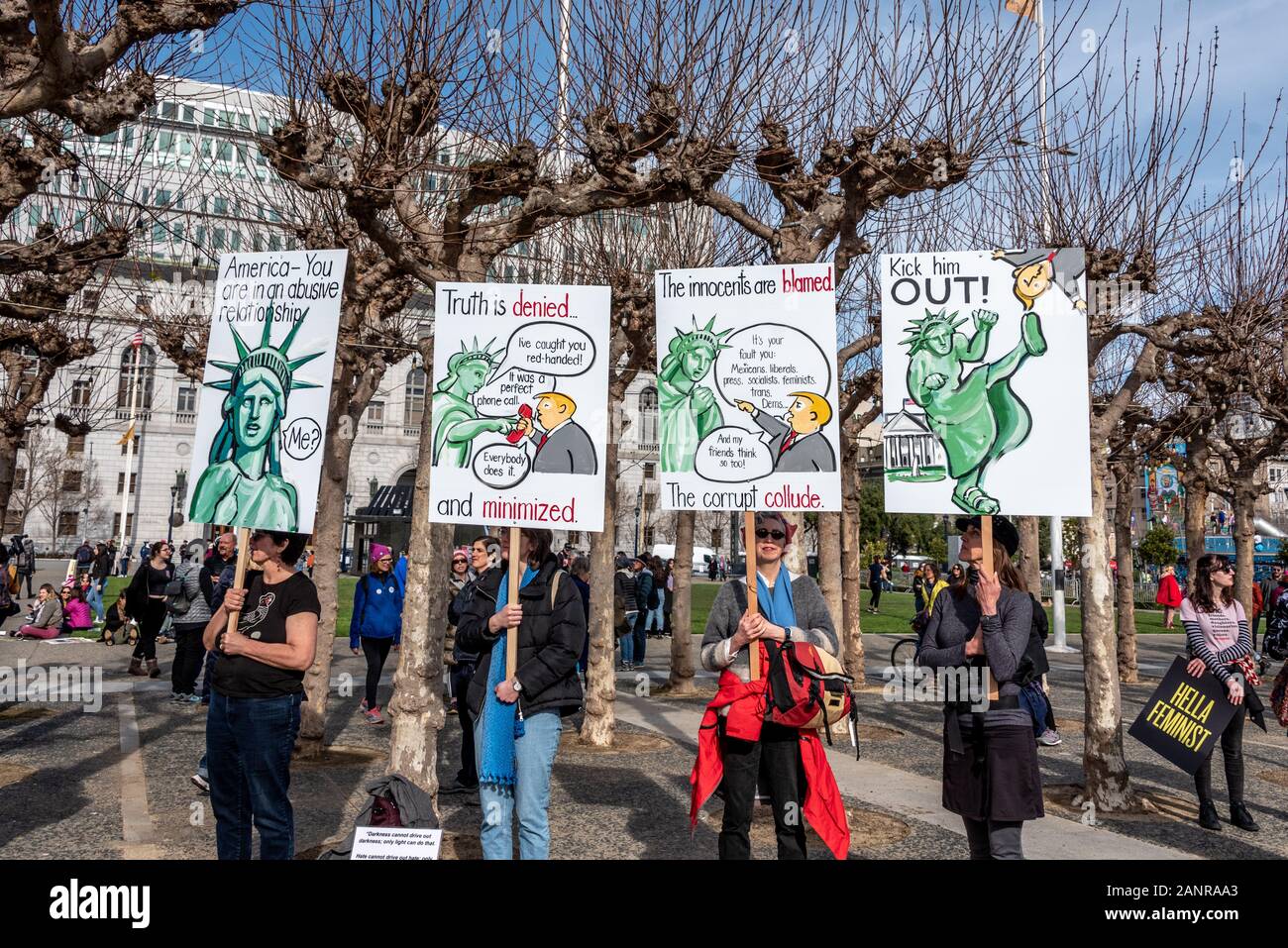 San Francisco, USA. 18th January, 2020. The 4th annual Women's March San Francisco, California. Demonstrators hold four signs with political cartoon drawings depicting an abusive relationship between the Statue of Liberty and President Donald Trump. Stock Photo