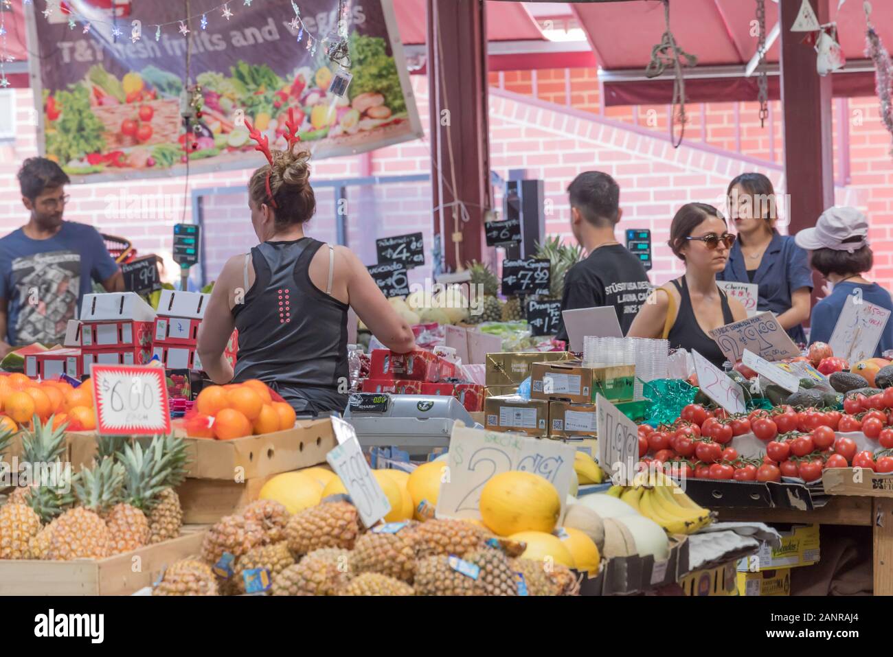 People buying and selling fresh fruit and vegetables at the famous