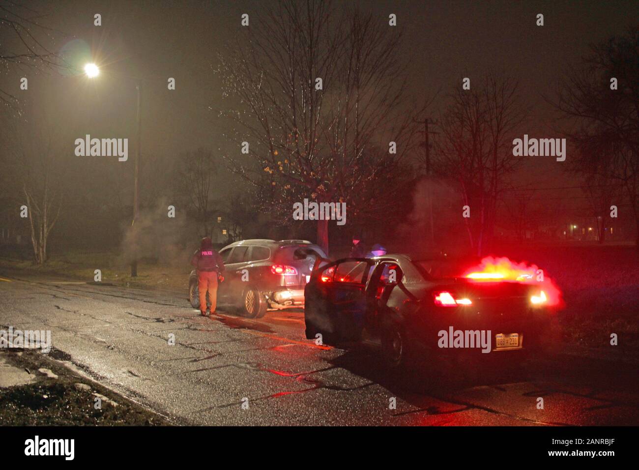 Detroit police Special Ops officers speak to a driver during a traffic