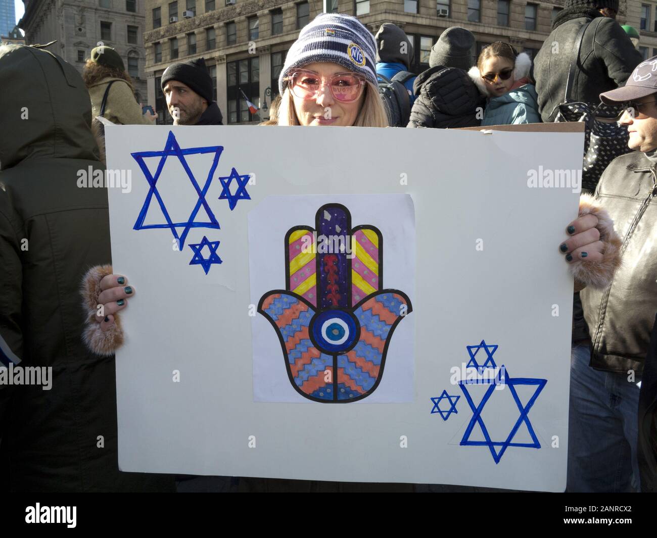 New York, USA. 5th January, 2020. No Hate No Fear March against anti-semitism. Poster of Hamsa hand and Star of David symbols of protection. Stock Photo