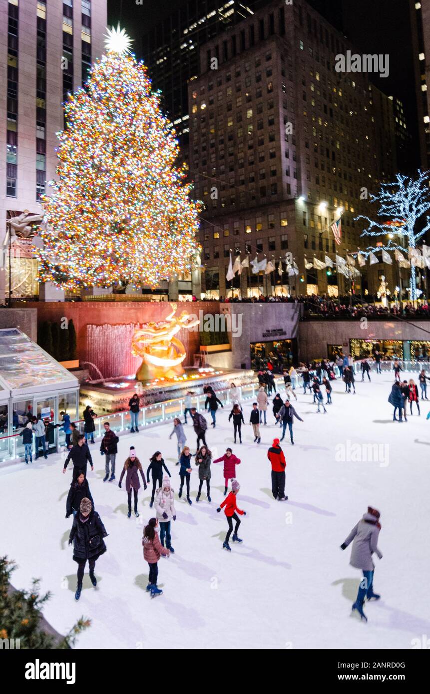 People Ice Skating in The Rink at Rockefeller Center under the large