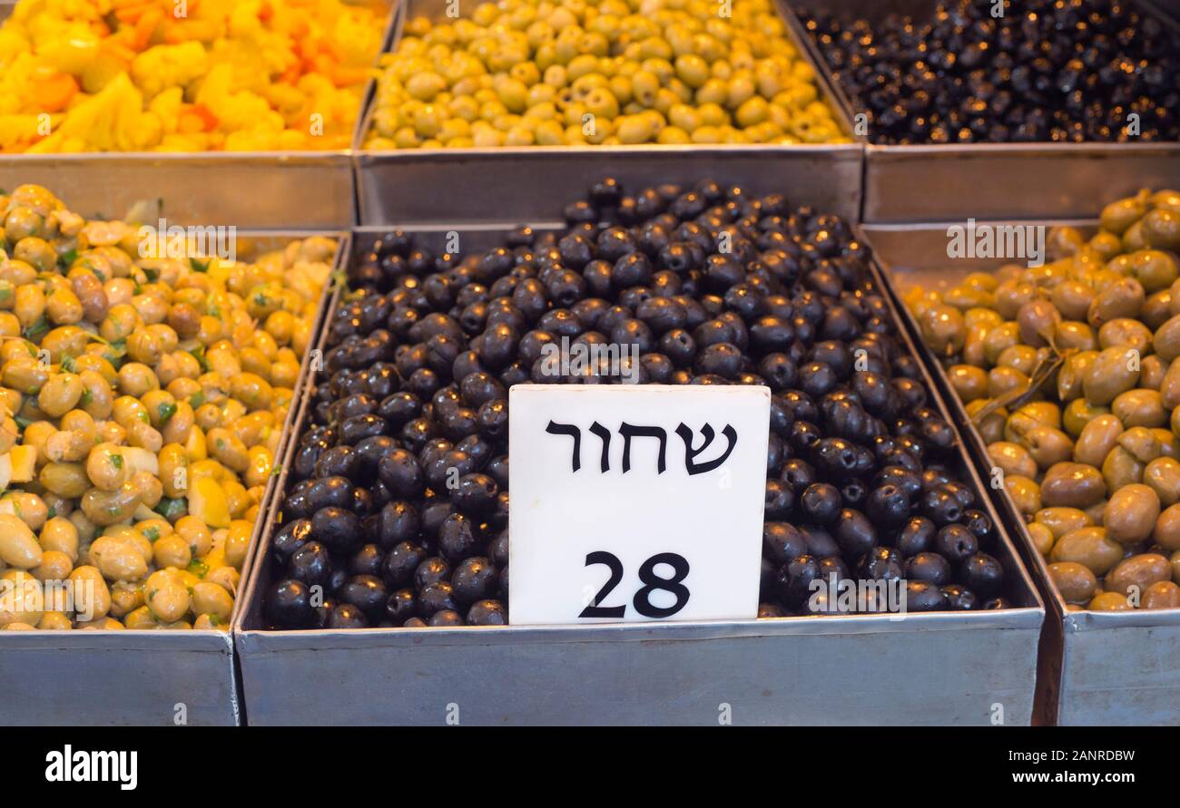 Olives on display in Mahane Yehuda market for a unit price of 28 shekels, Jerusalem Stock Photo