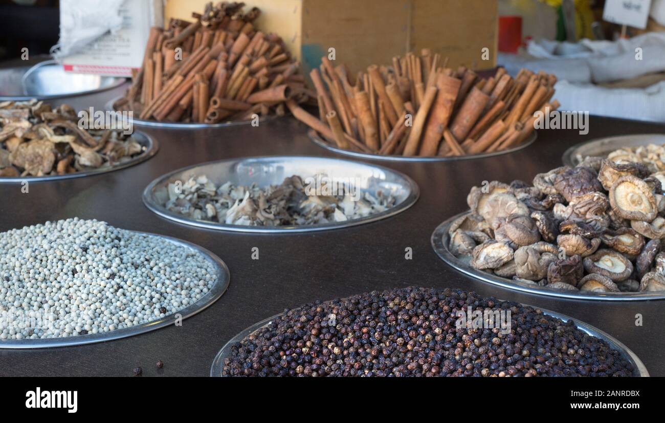 Peppercorns, mushrooms and cinnamon sticks on display in Mahane Yehuda market, Jerusalem, Israel Stock Photo