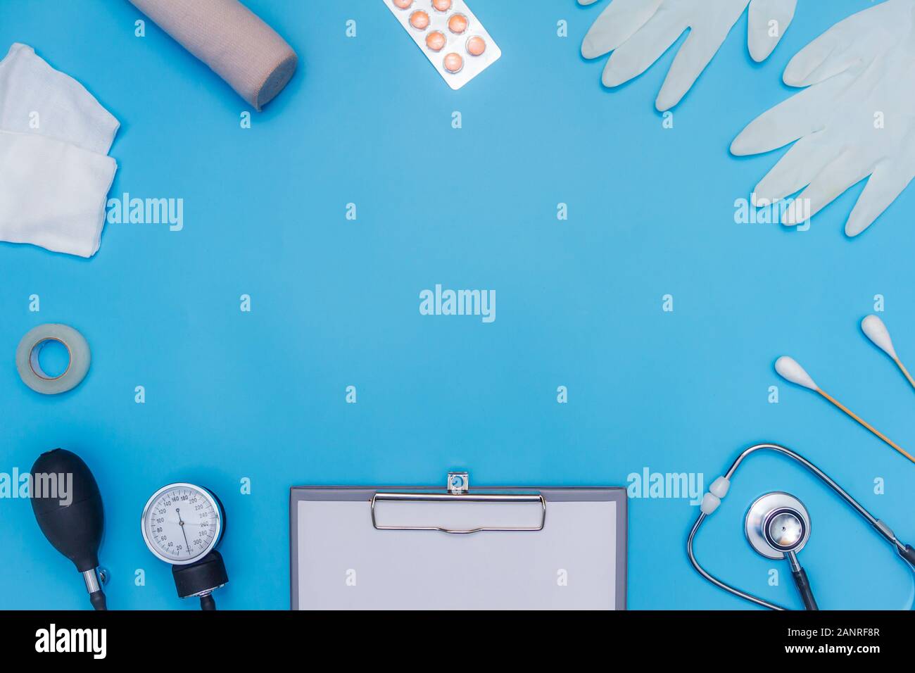 Medical equipment on blue background with text area Stock Photo - Alamy
