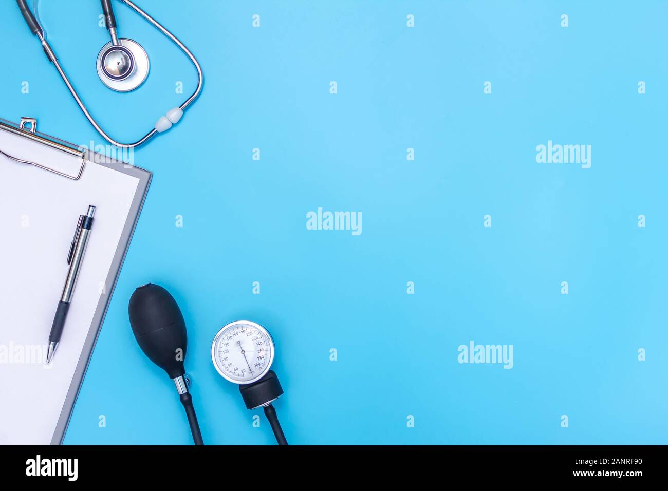 stethoscope and clipboard isolated on blue background Stock Photo - Alamy
