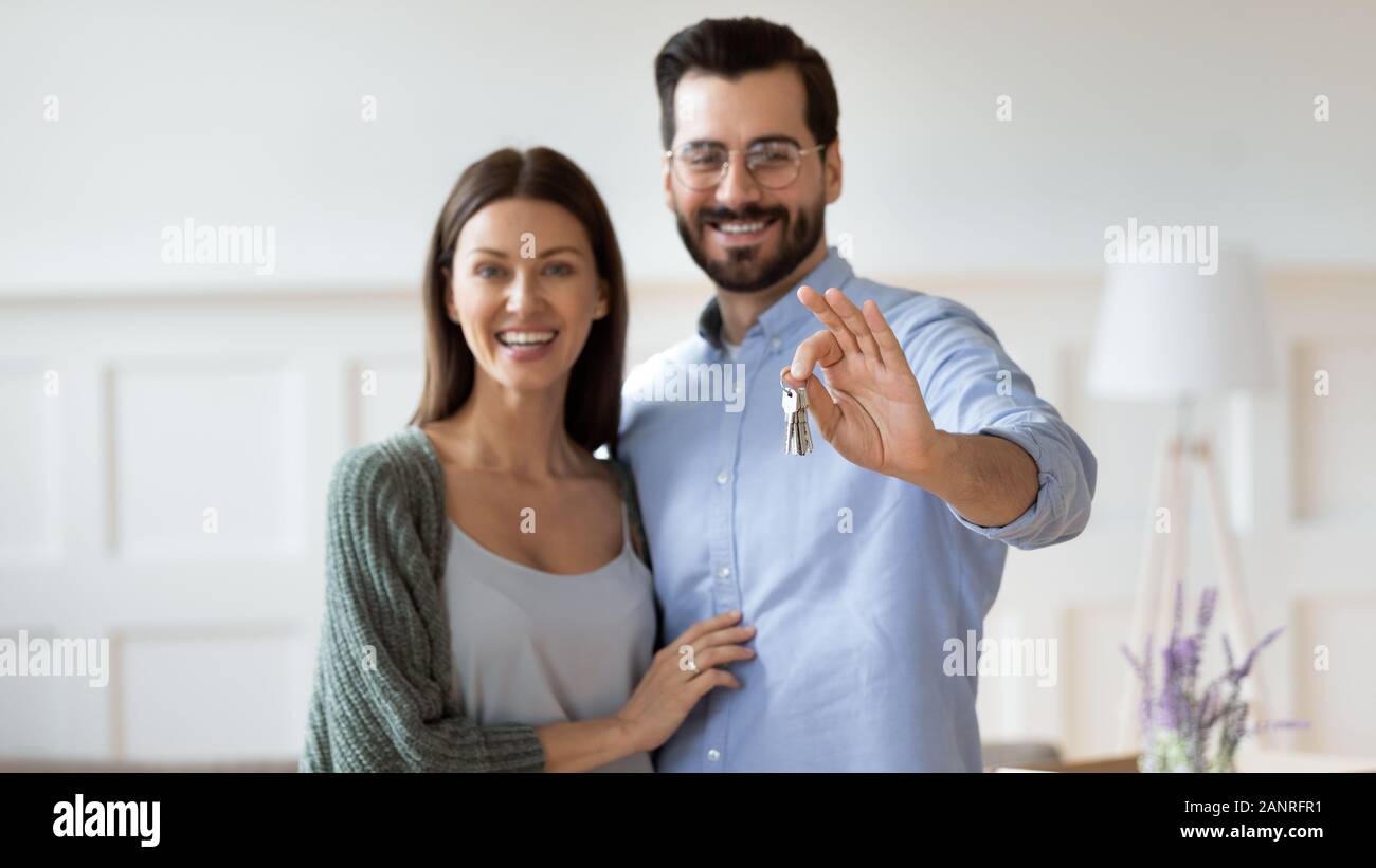 Portrait of happy couple showing house keys Stock Photo - Alamy