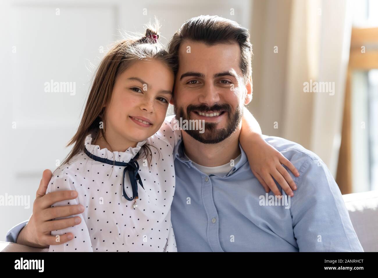 Portrait of happy dad and little daughter hug showing love Stock Photo