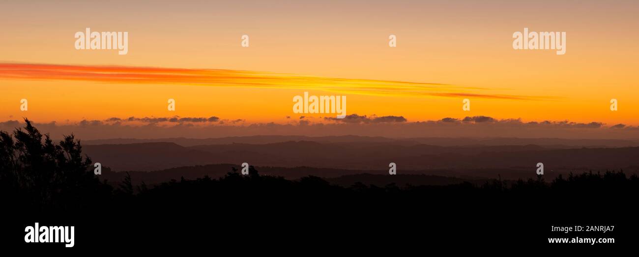 Sunset over the rolling mountains in Central Plateau. Viewed from Tongariro National Park Stock Photo