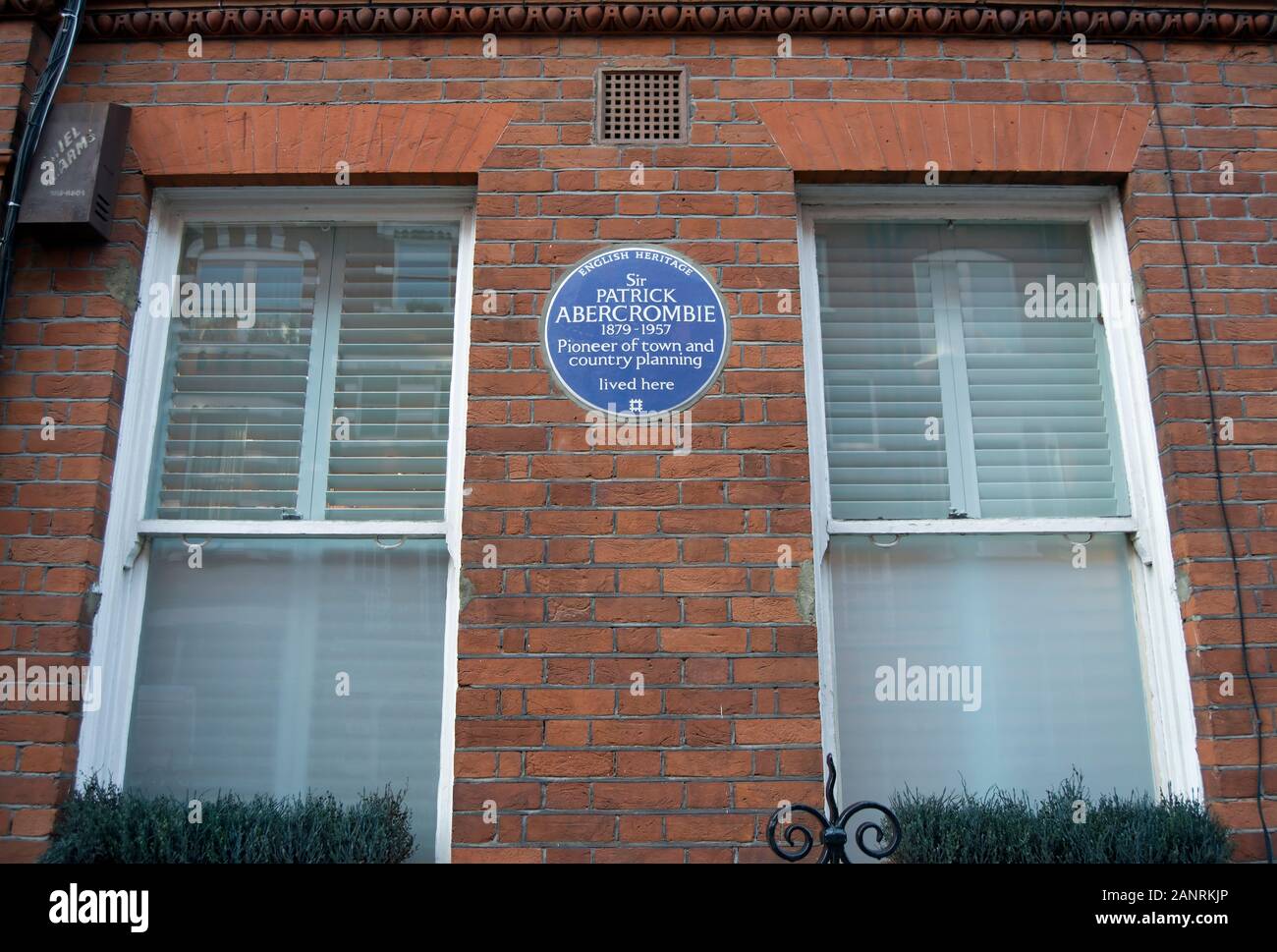 english heritage blue plaque marking a home of town and country planning pioneer, sir patrick abercrombie, south kensington, london, england Stock Photo