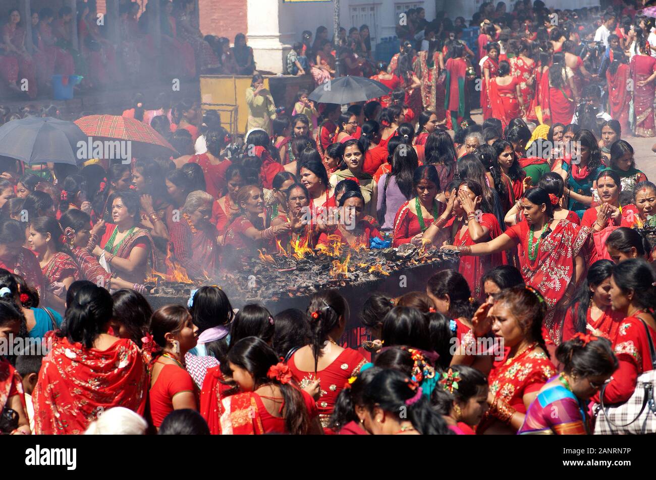 Teej festival, group of Nepali hindu women praying around the fire
