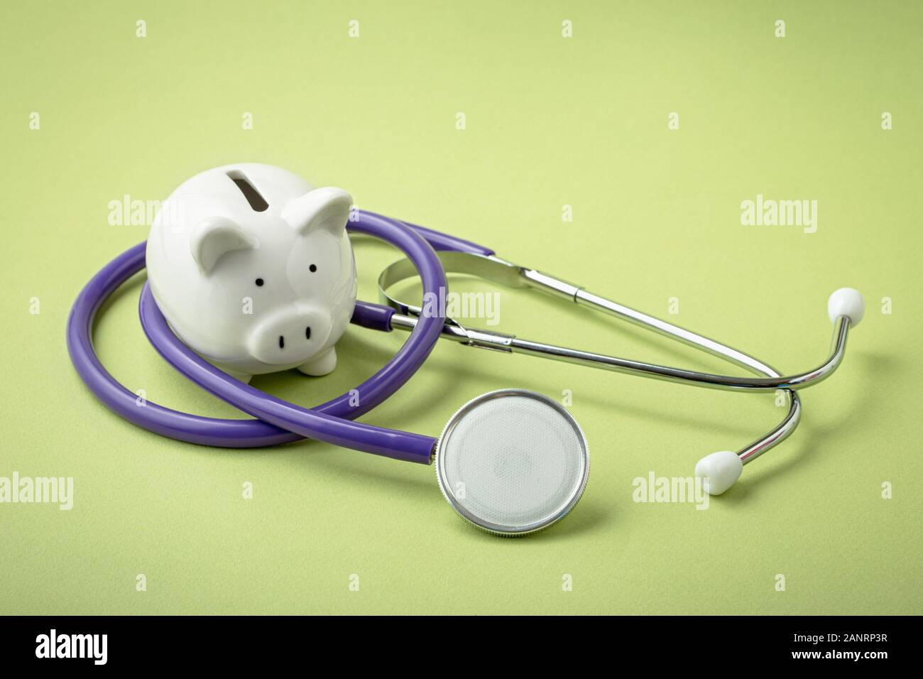 Piggy bank with stethoscope Stock Photo