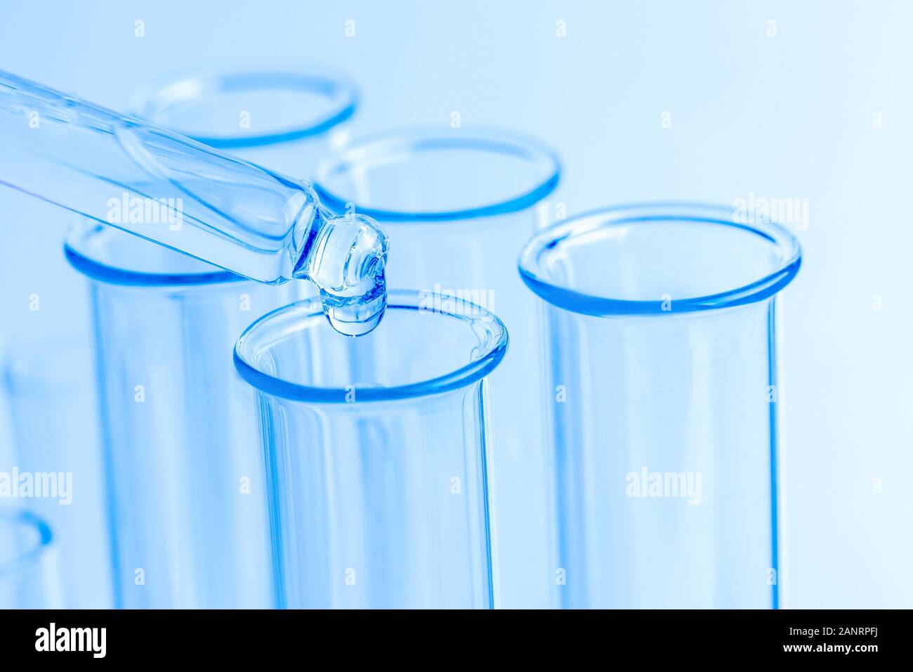Science laboratory test blue tubes, macro flask equipment. Chemical