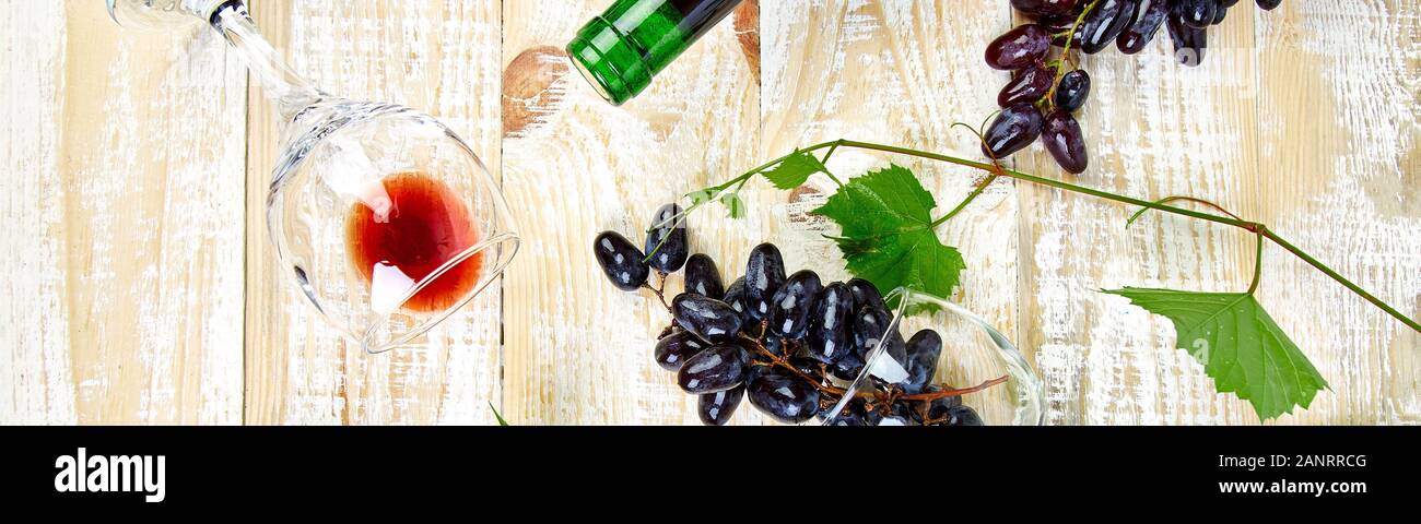 Banner of Red wine concept with bottle, glass and grapes on wooden ...