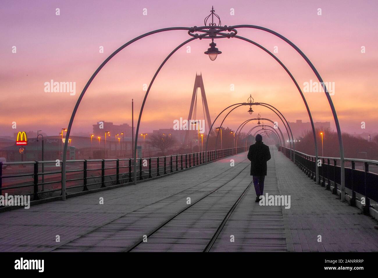 Southport, Merseyside, UK Weather 19th January, 2020 Frosty, freezing, cold misty start for early morning walkers on the resort's pier. The day is expected to be dry with wintry sunshine, and patches of fog slow to clear. Credit; MediaWorldImages/AlamyLiveNews Stock Photo