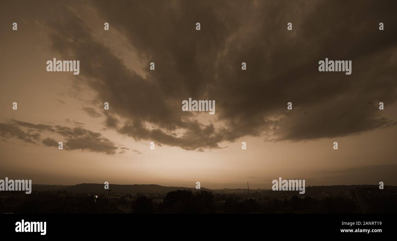 Beautiful sunset sky above clouds with dramatic light Stock Photo - Alamy