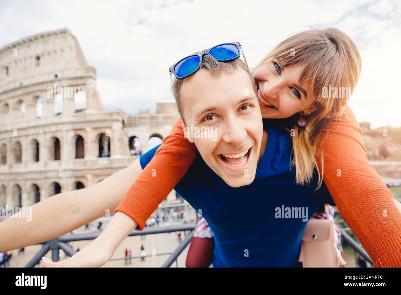 Travel couple man and girl taking selfie photo Colosseum landmark in Rome city. Concept europe Italy summer, people smiling Stock Photo