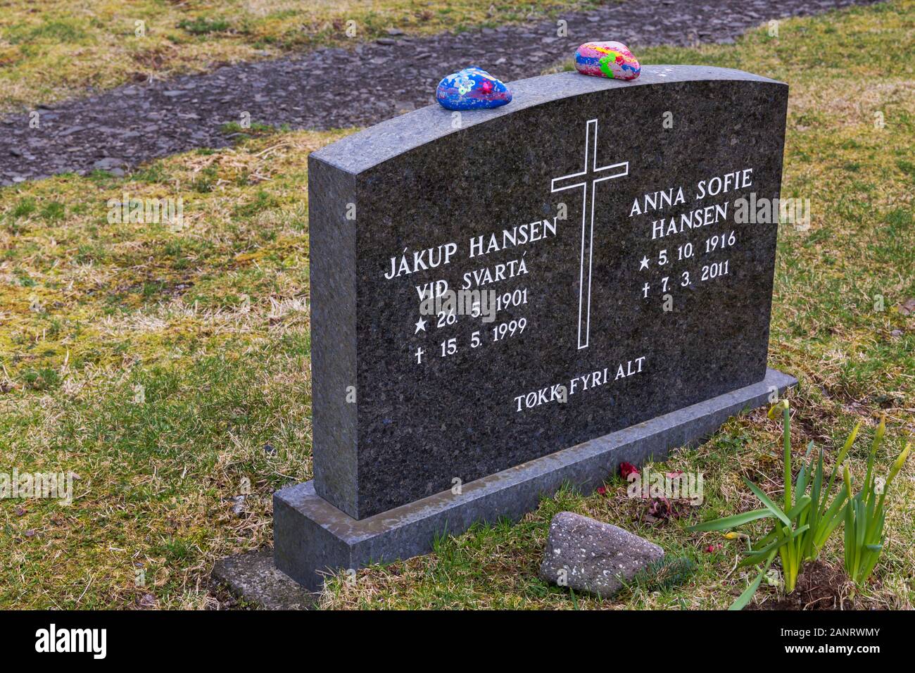 Headstone in church cemetery at Saksun ancient village, Streymoy, Faroe Islands, Denmark in April Stock Photo