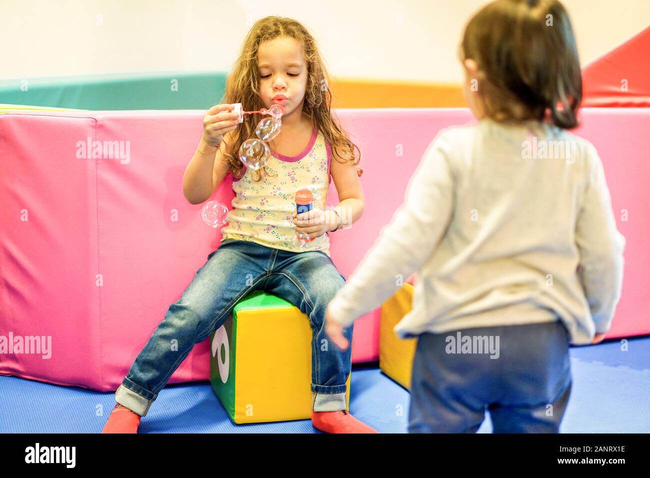 Children blowing bubbles in school hi-res stock photography and images ...