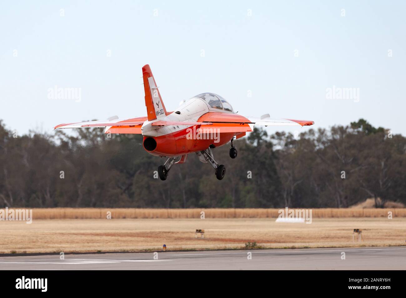 Siai Marchetti S.211 military trainer jet VH-DZJ in the markings of the Republic of Singapore Air Force about to land at Temora Airport. Stock Photo