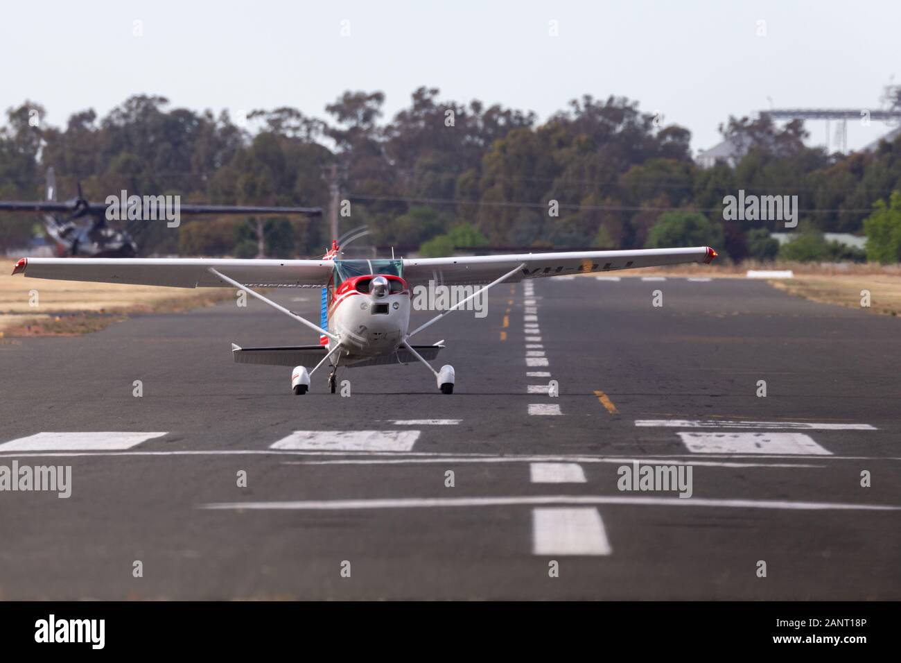 Cessna 185 Skywagon single engine light aircraft VH-OLI taxis down the runway at Temora Airport. Stock Photo