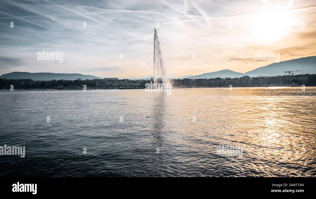 Panoramic view of Geneva lake with the famous Jet d'Eau or water jet and cityscape in of Geneva Switzerland Stock Photo