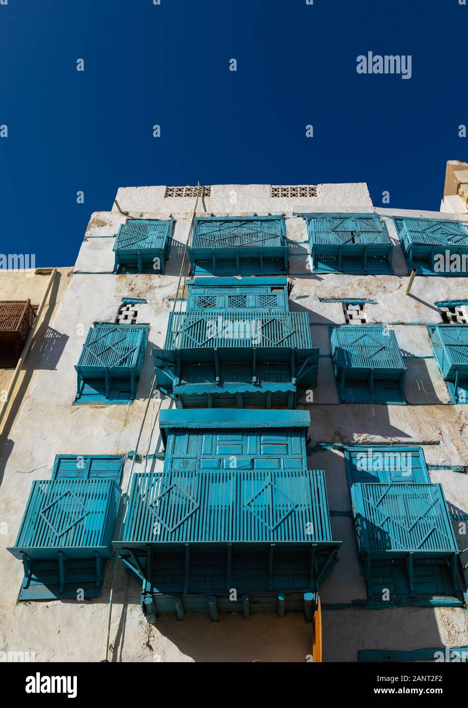 Historic house with blue wooden mashrabiyas in al-Balad quarter, Mecca province, Jeddah, Saudi Arabia Stock Photo