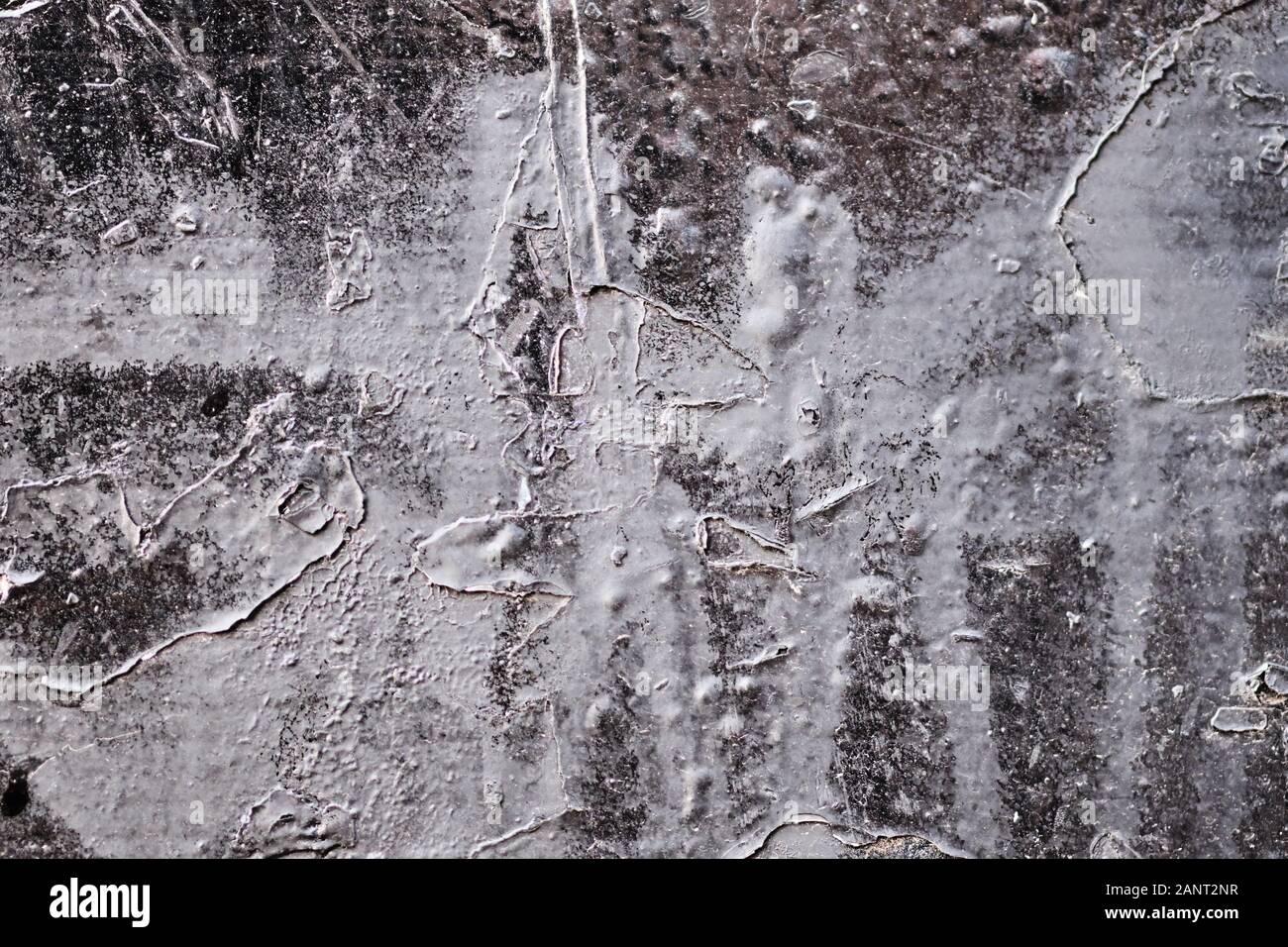 Black plaster with white lines from paint. Texture. Background. Stock Photo