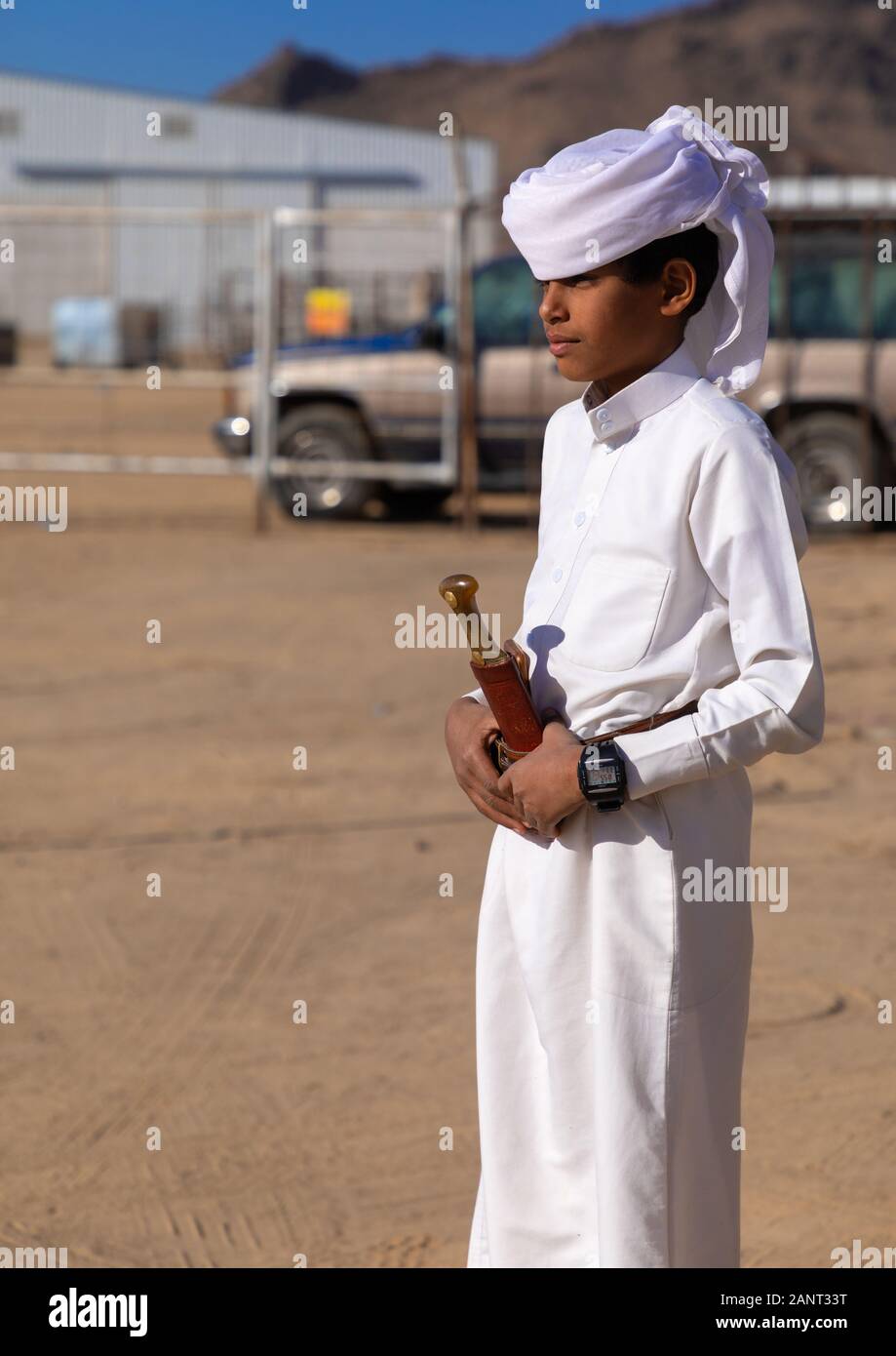 Portrait of a saudi boy wearing a white tradtional clothing, Najran Province, Najran, Saudi Arabia Stock Photo