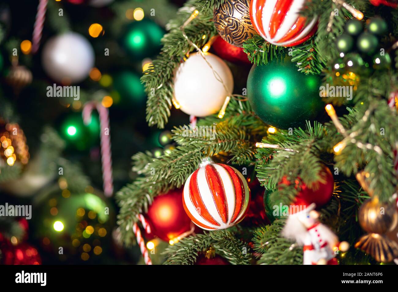 Christmas background tree branch with decorations candy lollipop cane ...