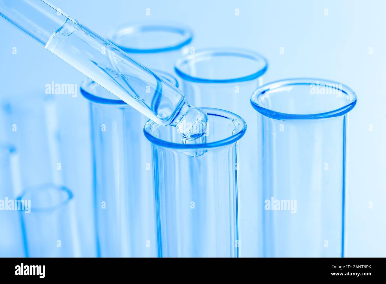 Science laboratory test blue tubes, macro flask equipment. Chemical