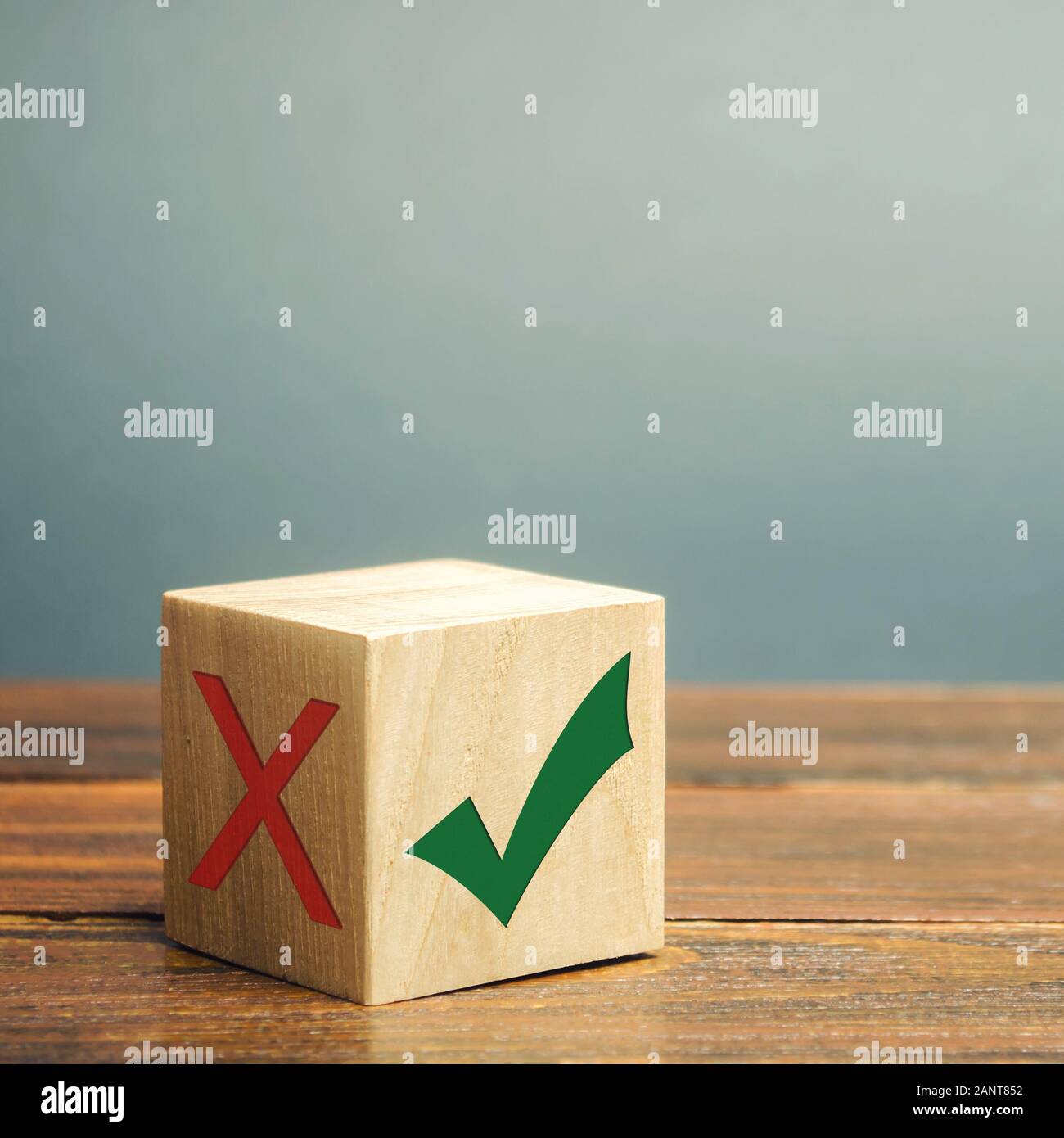 Wooden block with a green check mark. The concept of choice and making the right decision. Business management. Plan, planning. Referendum Stock Photo