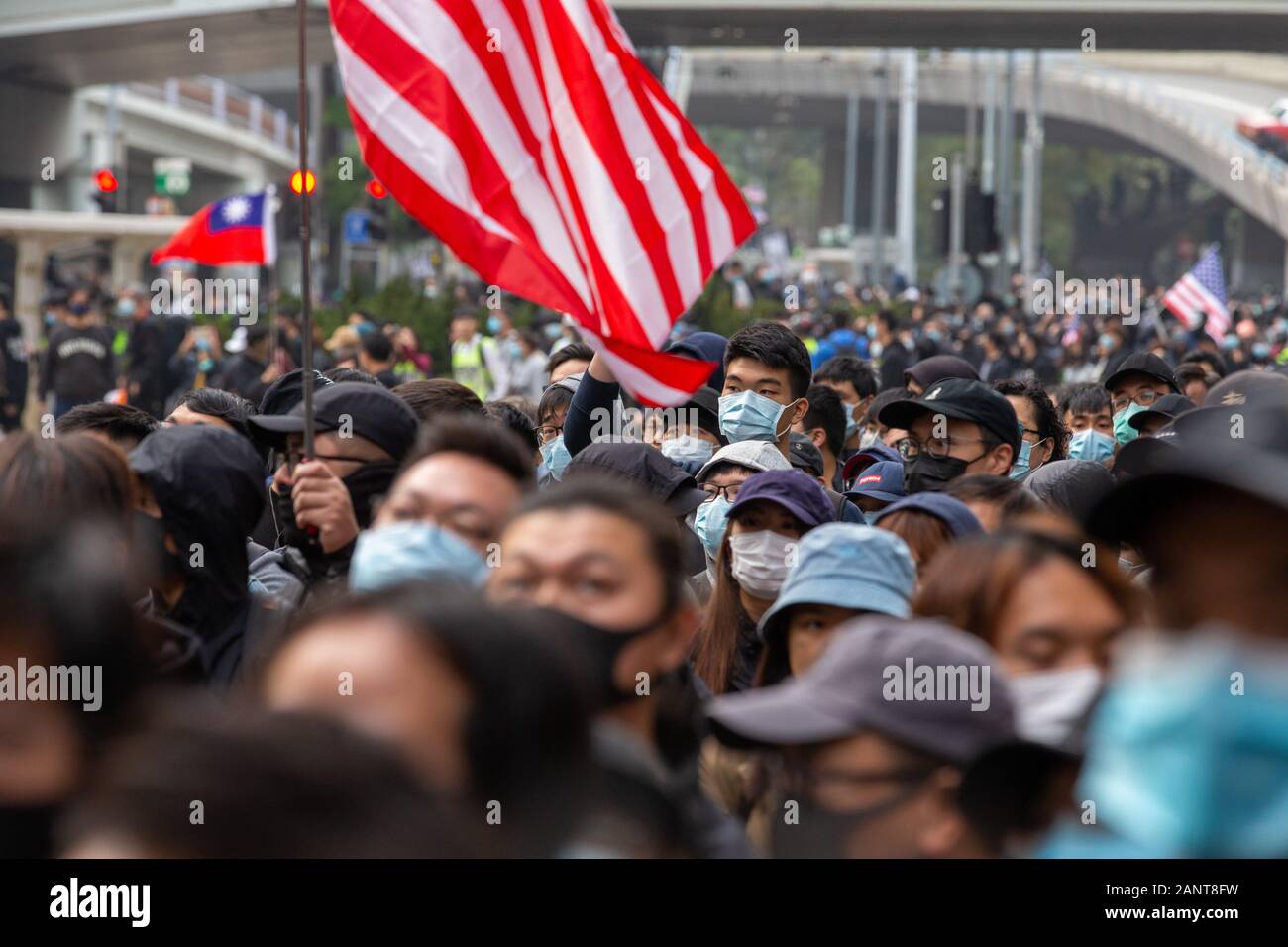 Hong Kong, China. 19th Jan, 2020. Crowd on the move trying to march to Wanchai but the Police stopped them at Admiralty. Hong Kong Protest - Universal Seige on Communists Rally at Chater Garden, Central, Hong Kong. Credit: David Ogg/Alamy Live News Stock Photo
