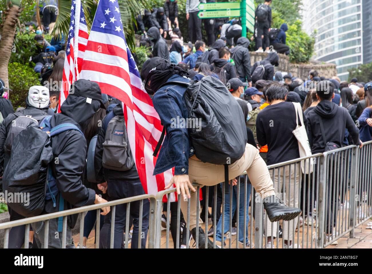 Hong Kong, China. 19th Jan, 2020. Protestors retreating from the police at the Hong Kong Protest - Universal Seige on Communists Rally at Chater Garden, Central, Hong Kong. Credit: David Ogg/Alamy Live News Stock Photo